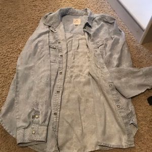 Button up baby blue denim long sleeve shirt.